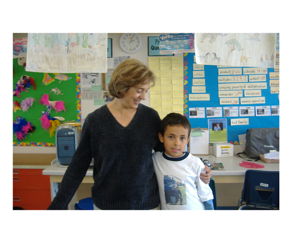 Photo of teacher and student in classroom